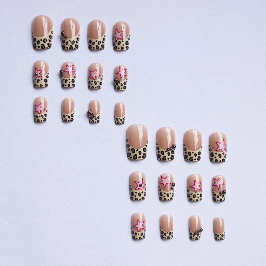 French style leopard print nail art strips with pearl and five-pointed star decorations for manicures.
