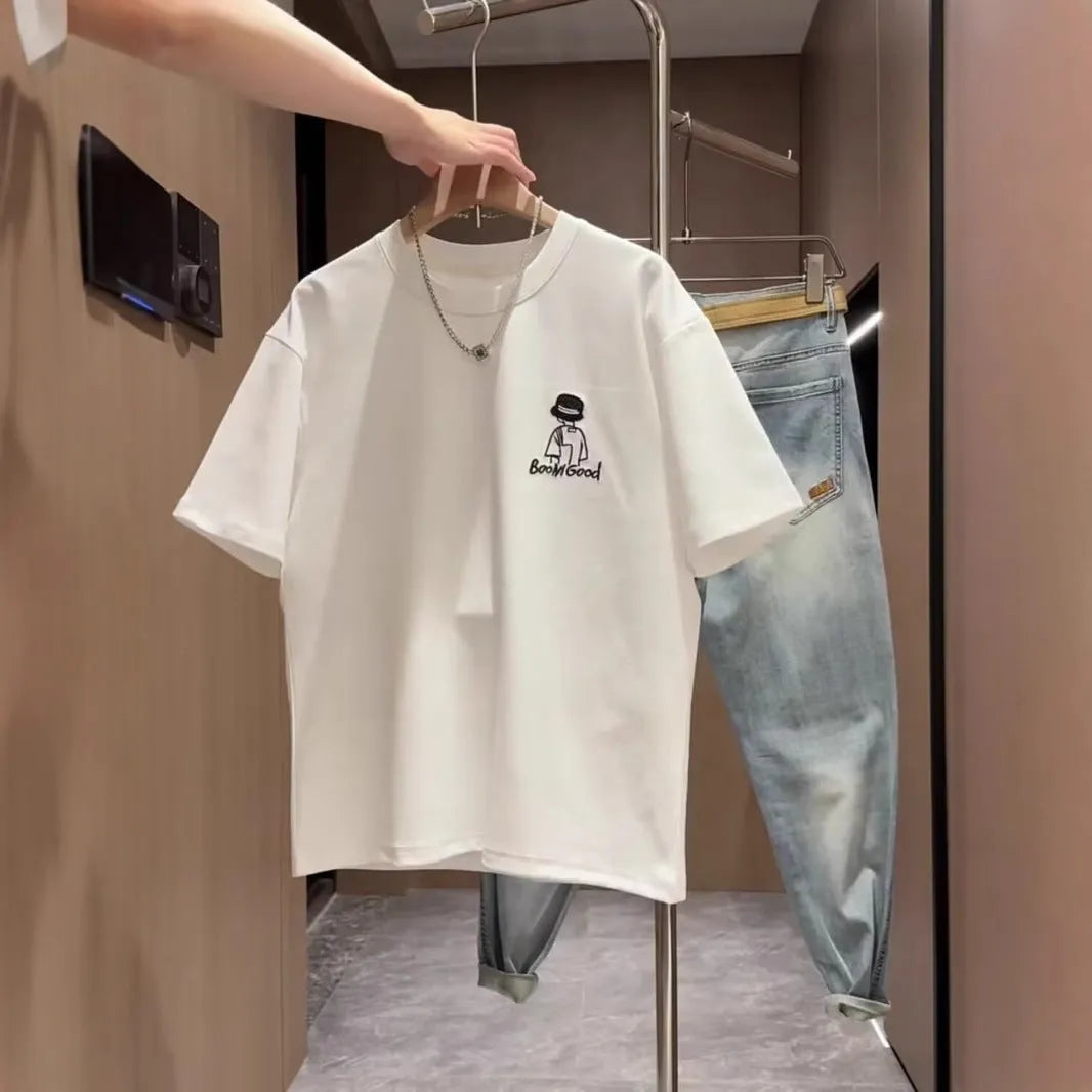 Men's black and white cotton short sleeve t-shirt with cartoon print, showing crew neck and straight cut.