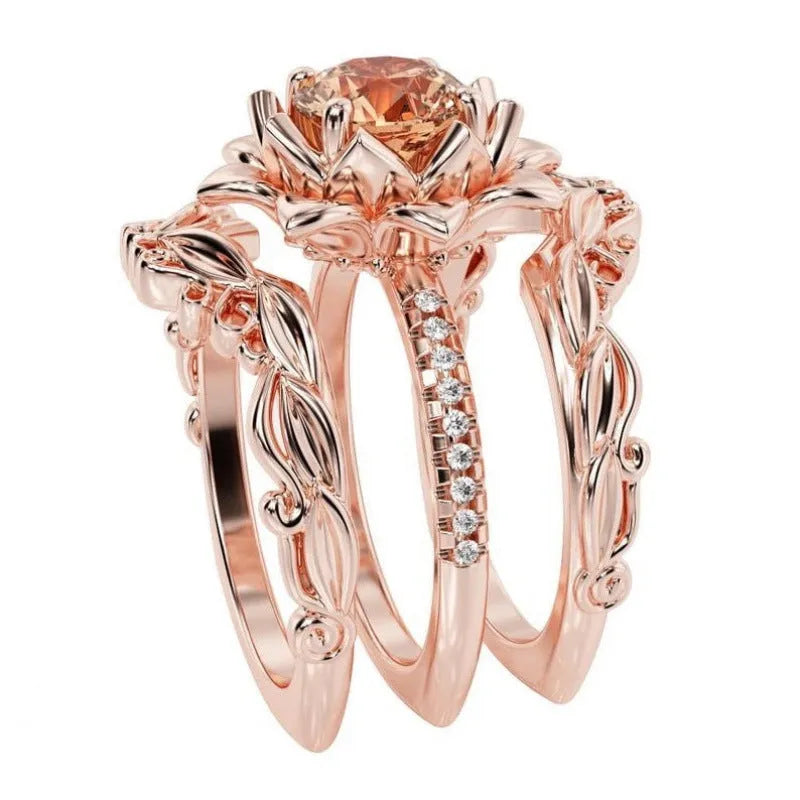 Rose design alloy ring with zircon inlay, shown in rose gold, black pink diamond, and black seven-colour rhinestone colour options.
