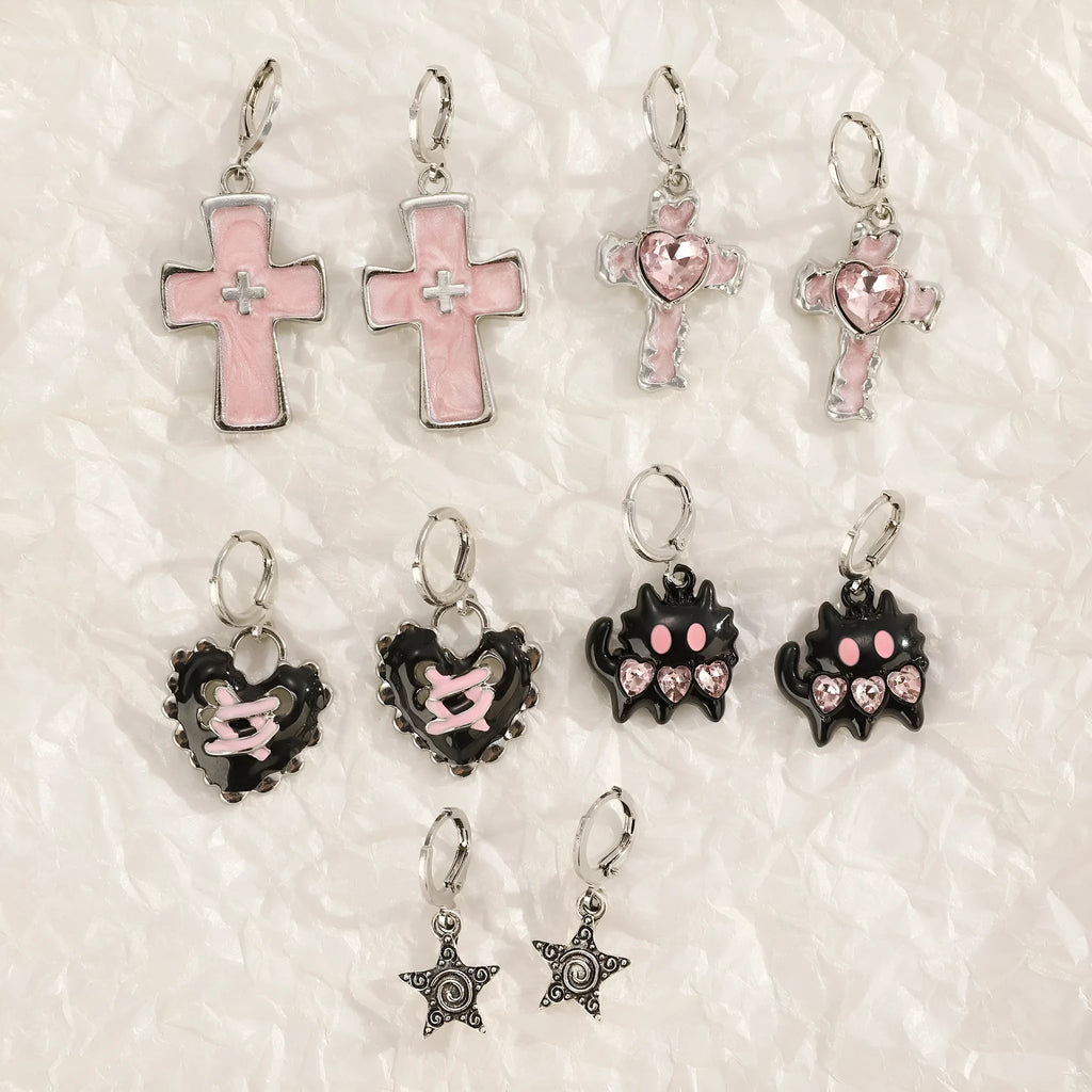 Women's classic alloy earrings with cross crystal design in five colour options on display