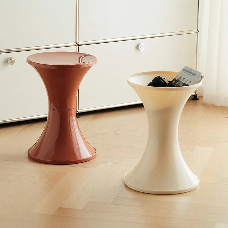 A plastic hourglass-style shoe changing stool in one of five available colours.