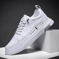 Men's black and white skateboard shoes with microfiber upper and elastic band closure