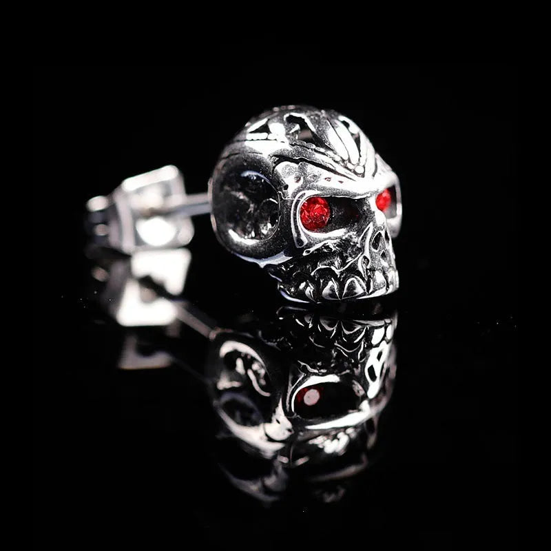Retro skull stud earrings with red eye detailing on alloy metal with electroplated finish
