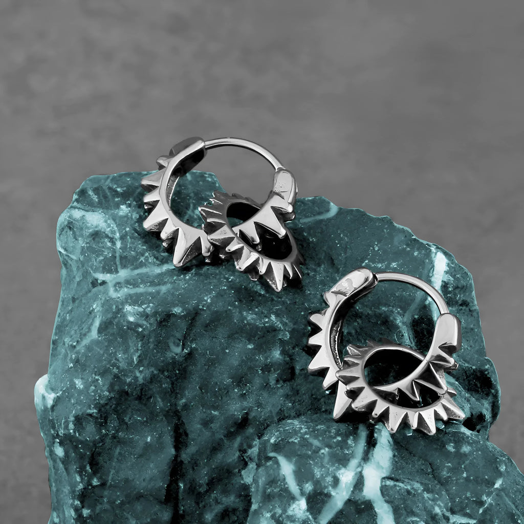 A pair of simple stainless steel round hoop earrings with a polished finish in a steel colour.