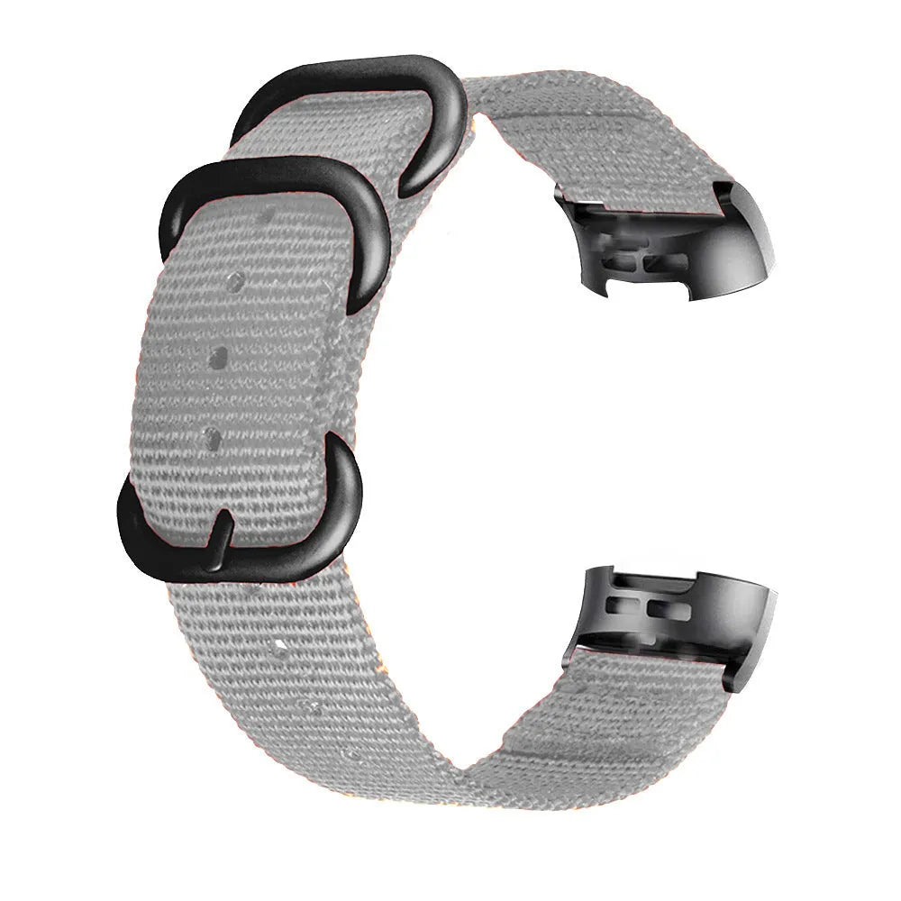 Nylon three-ring buckle replacement strap for Fitbit Charge 2, 3, 4, and 5 fitness trackers in multiple colours