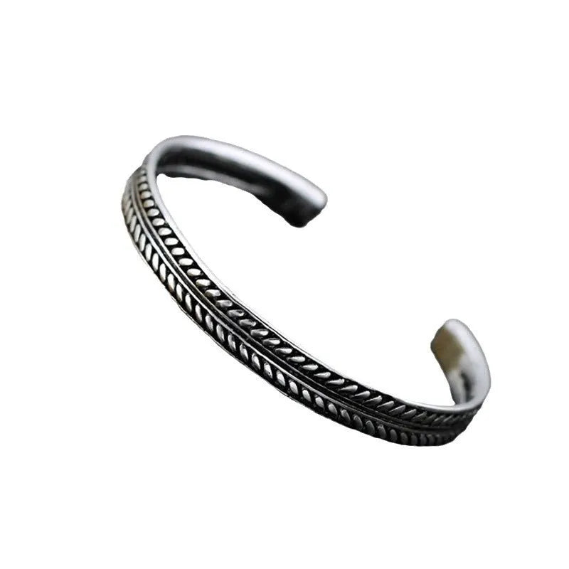 Women's silver-toned bracelet with Chinese retro fish design and magnetic clasp.