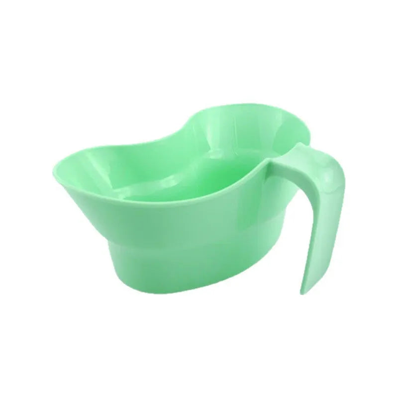 Green plastic gargle cup for bedside patient mouth care and hygiene.