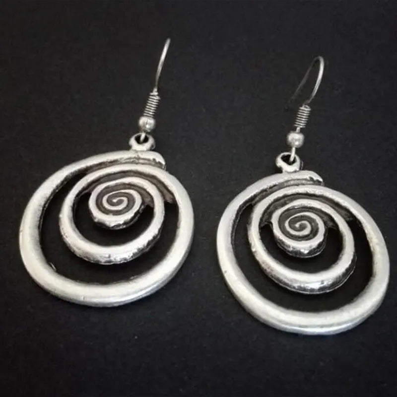 Silver geometric spiral distressed earrings with tribal design measuring 2.6 by 5 cm