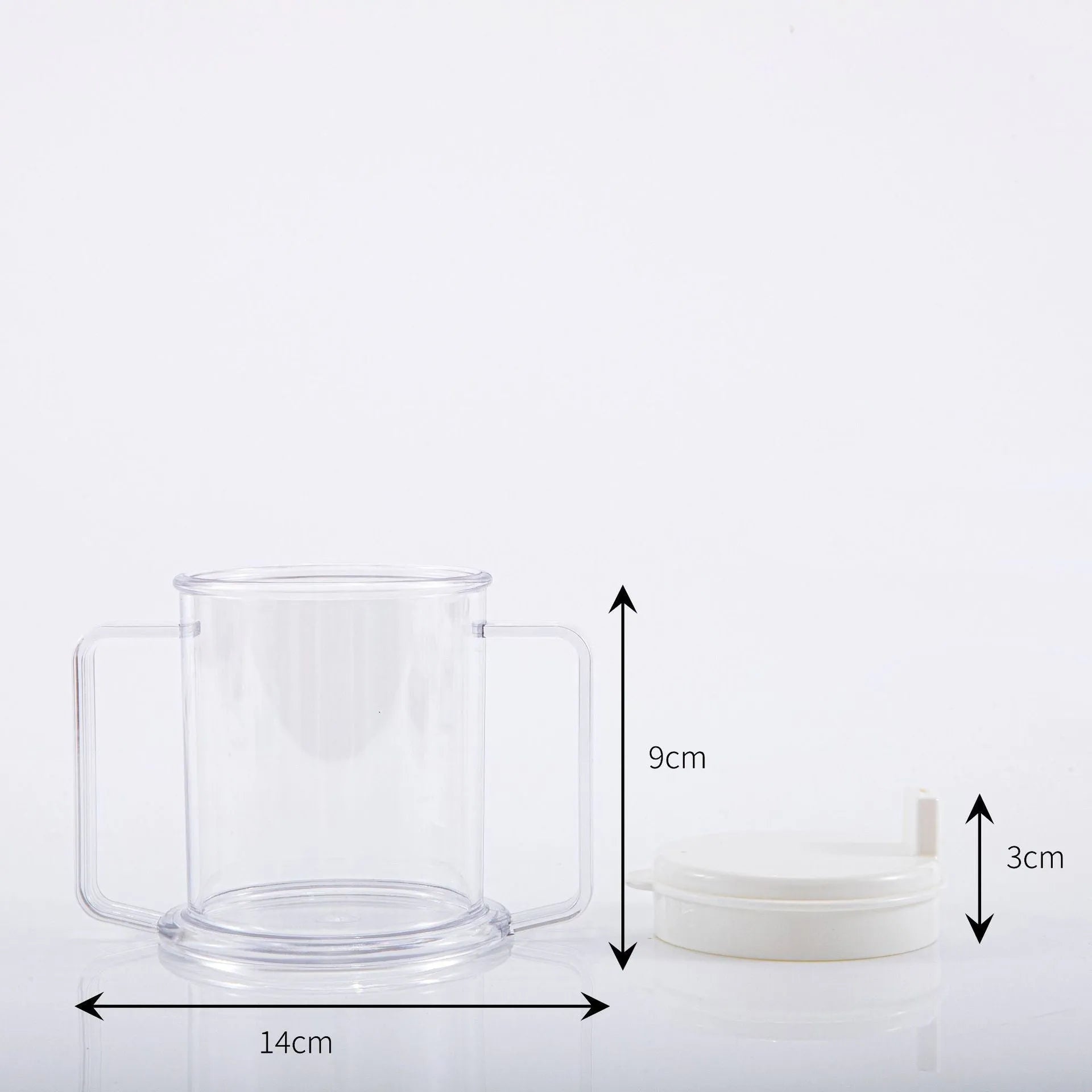 Transparent plastic spill-proof drinking cup on a table