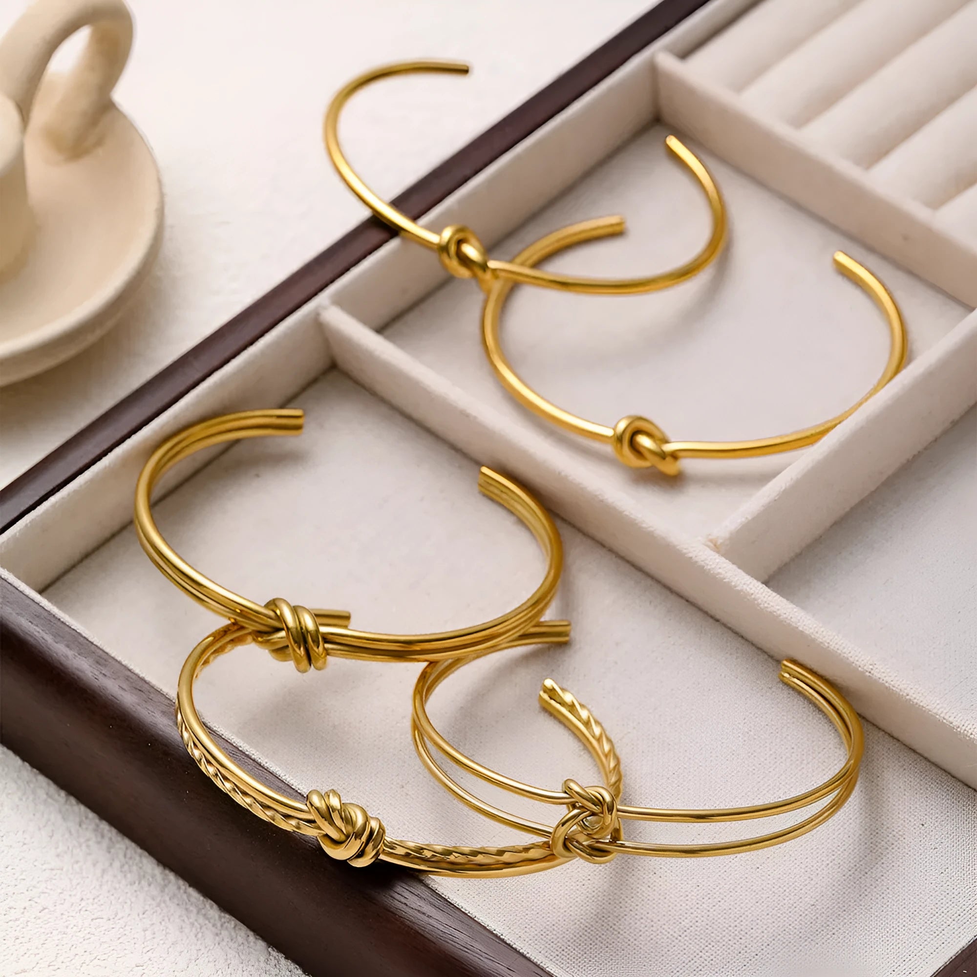 Women's adjustable stainless steel bracelet with knotted C-shaped open design and double-layer construction