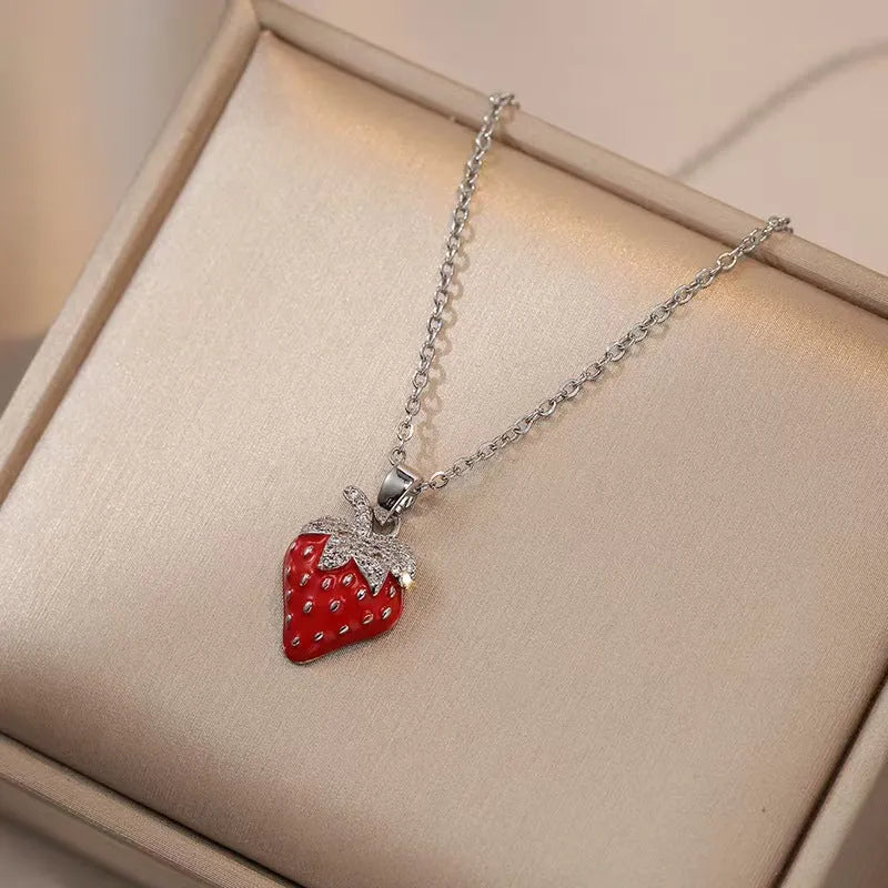 Delicate indie charm necklace with cherry, strawberry, and pepper pendants on a titanium steel chain.