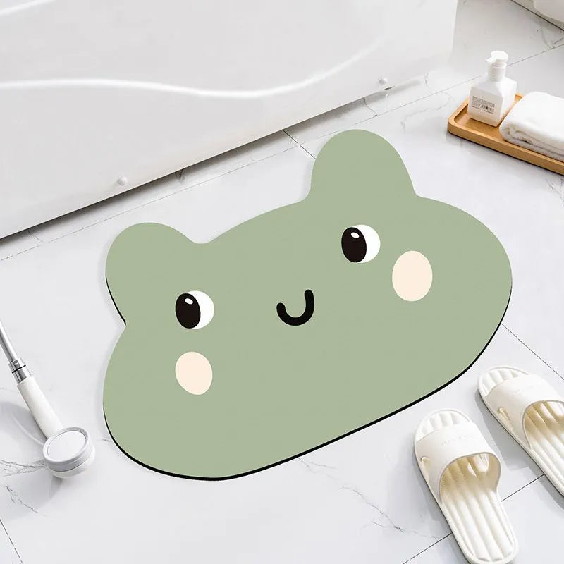 Cartoon animal diatomite absorbent bathroom mat in alien shape on bathroom floor.