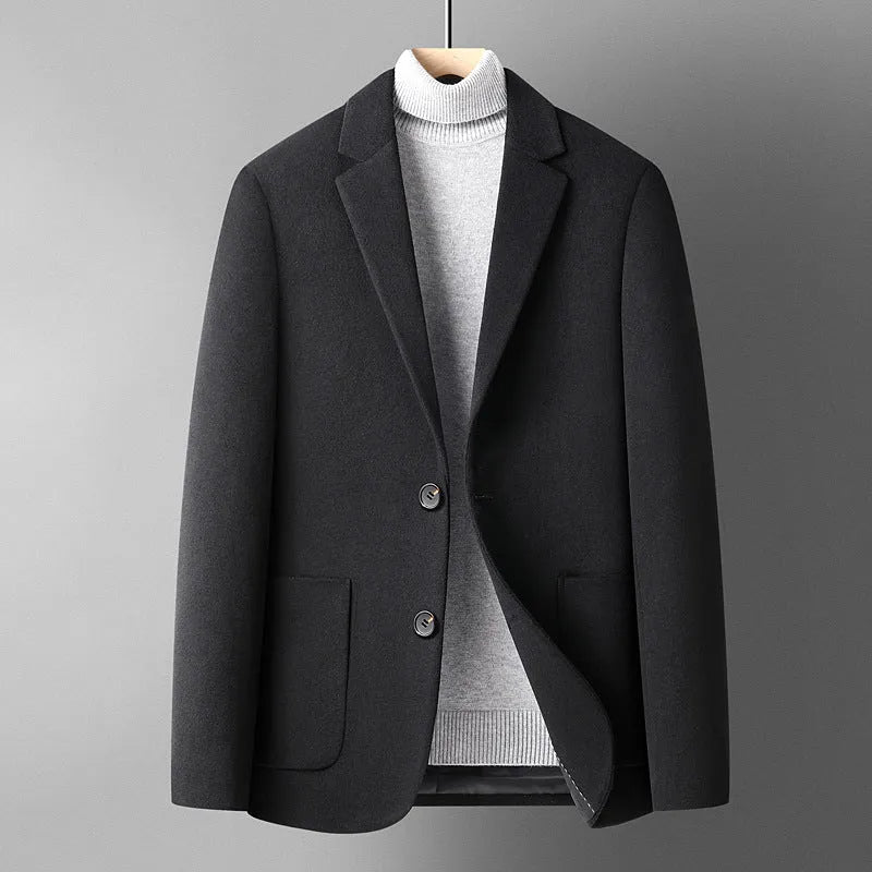 Men's slim-fit grey wool suit jacket with a notch lapel, shown on a hanger.