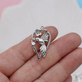 Gold-tone alloy magpie pendant charm for DIY jewellery making on a white background.