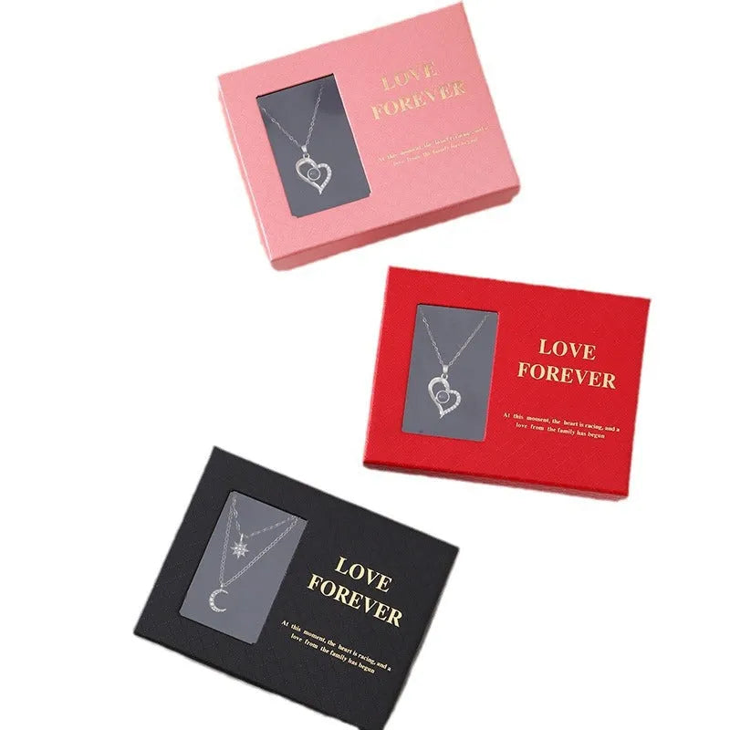 Red Korean-style gift box open to show six sculpted soap roses, with a matching handbag beside it.