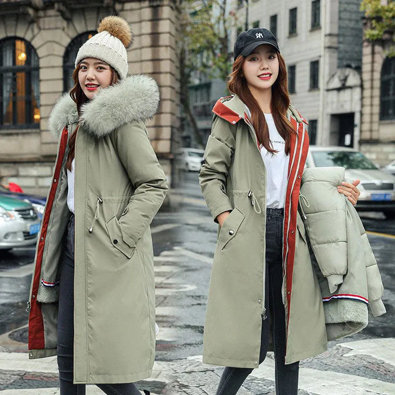 Women's long beige fleece trench coat with two-way zip, shown on a model.
