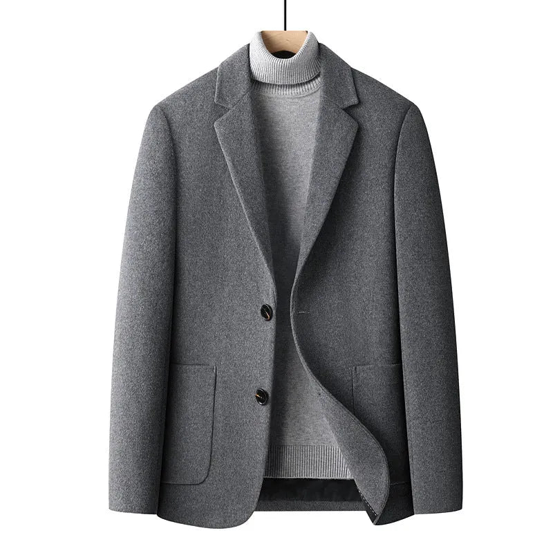 Men's slim-fit grey wool suit jacket with a notch lapel, shown on a hanger.