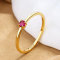 Geometric copper women's ring with single diamond in circle design, shown in available colours.