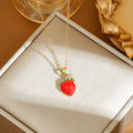 Delicate indie charm necklace with cherry, strawberry, and pepper pendants on a titanium steel chain.