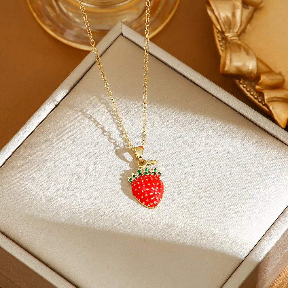 Delicate indie charm necklace with cherry, strawberry, and pepper pendants on a titanium steel chain.