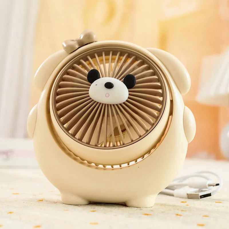 Small plastic desktop fan with a cute dog design, showing USB port and control buttons.