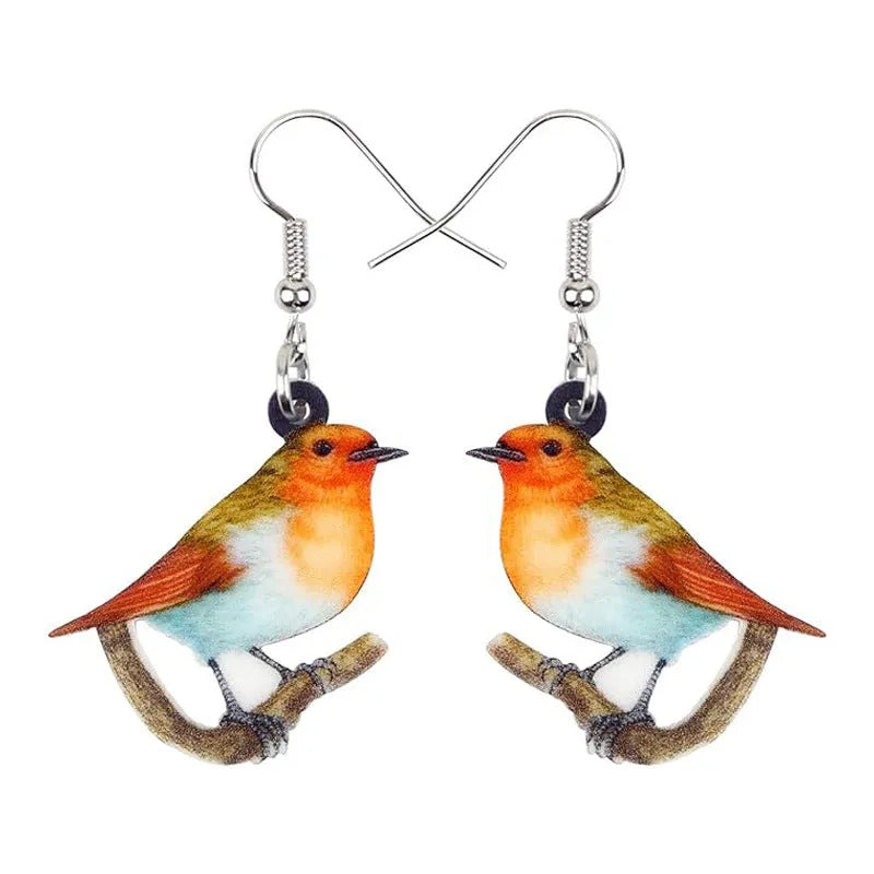 Blue Titmouse and snake motif acrylic drop earrings with geometric pendant shape on a white background.