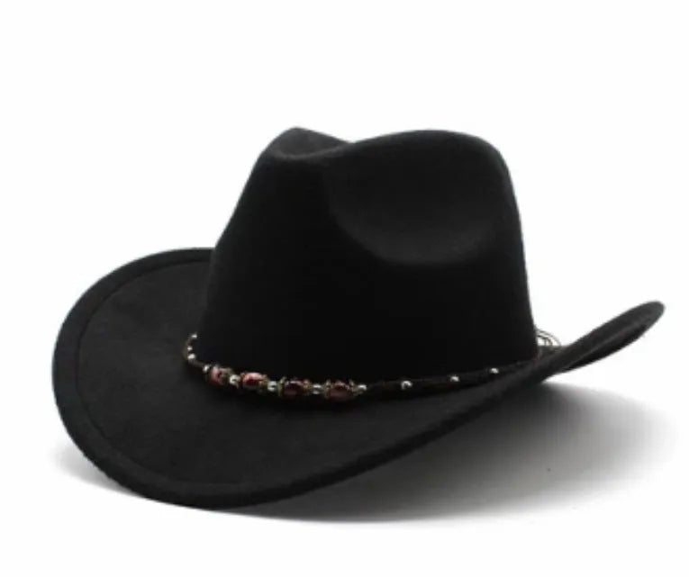 Brown leather velvet cowboy hat with curved brim and conical crown on a wooden post.