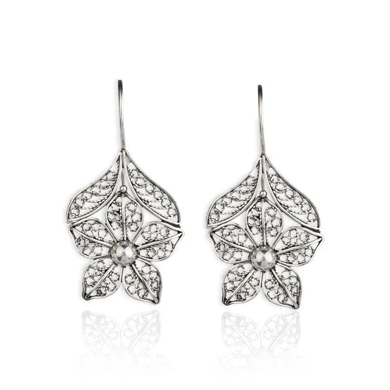 Silver alloy hollow flower leaf-shaped women's earrings with retro floral metal design