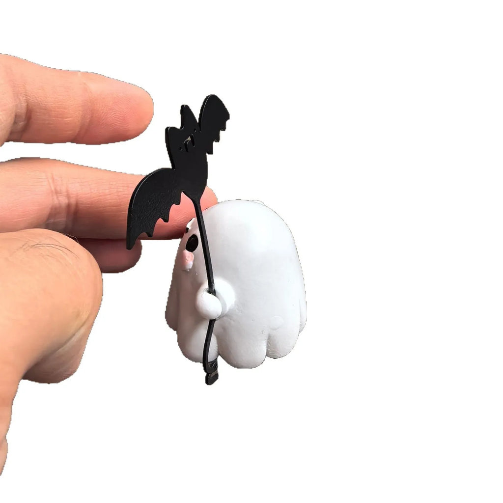Mini resin statue of a white ghost walking a black bat, Halloween decoration