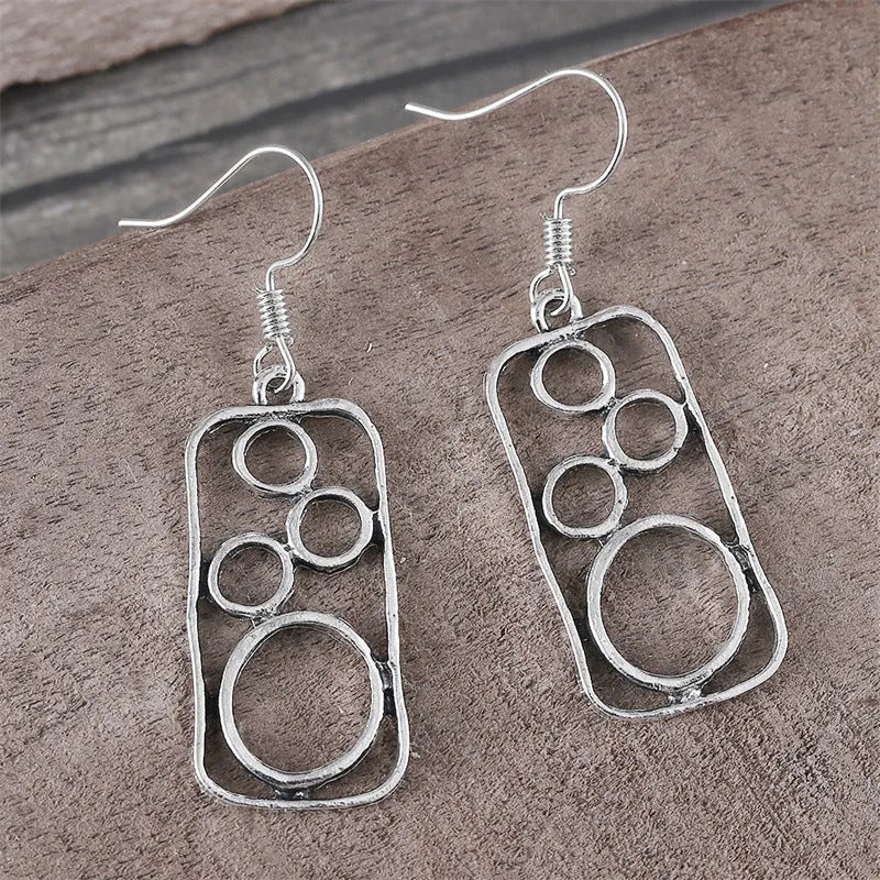 Geometric round ring earrings with irregular square shape in antique silver colour