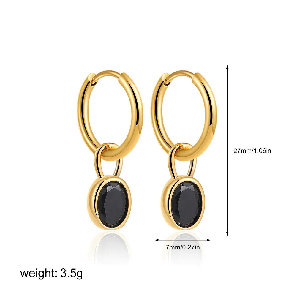A pair of women's retro oval zircon drop earrings in a copper setting on a white background.