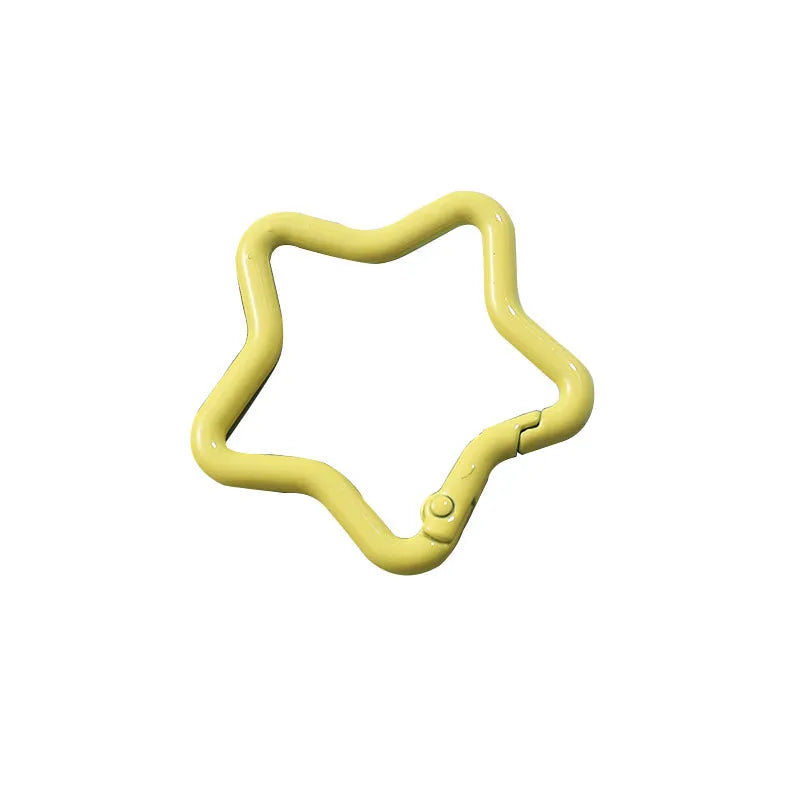 Zinc alloy five-pointed star keychain charm in multiple colour options on a white background.
