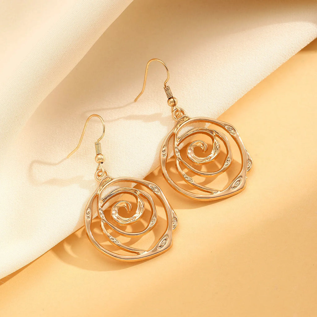 Spiral donut geometric jewellery set with necklace, bracelet, and earrings in gold electroplate