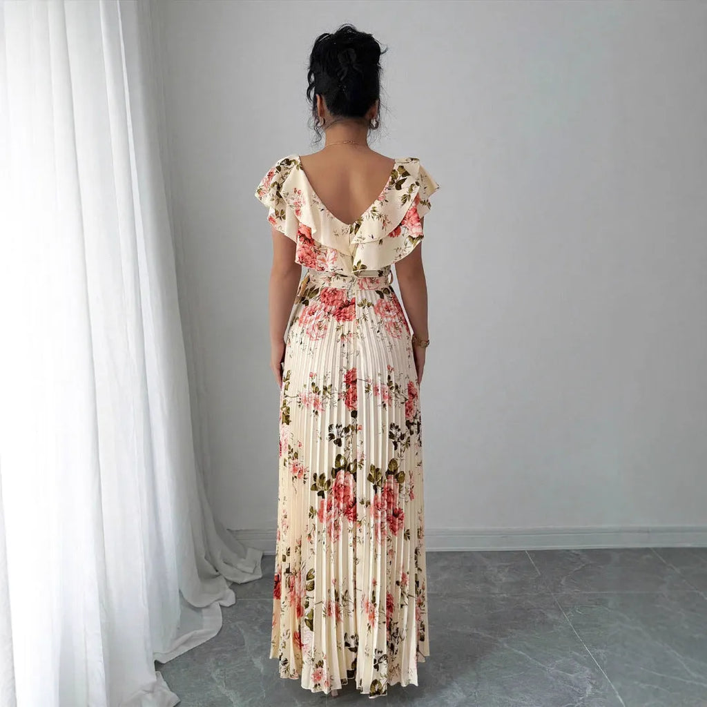 Apricot floral print women's dress with v-neck, ruffled sleeves, and a high-waisted long swing skirt.
