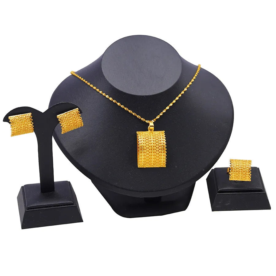 Golden copper bridal jewellery set showing necklace, earrings and ring combination for wedding accessories