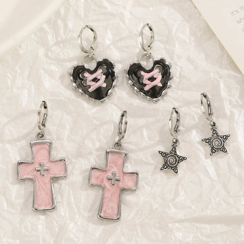 Women's classic alloy earrings with cross crystal design in five colour options on display