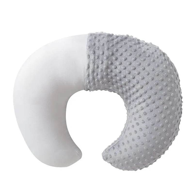 Nursing pillow with removable cover in light blue, featuring a built-in milk spilt preventer.