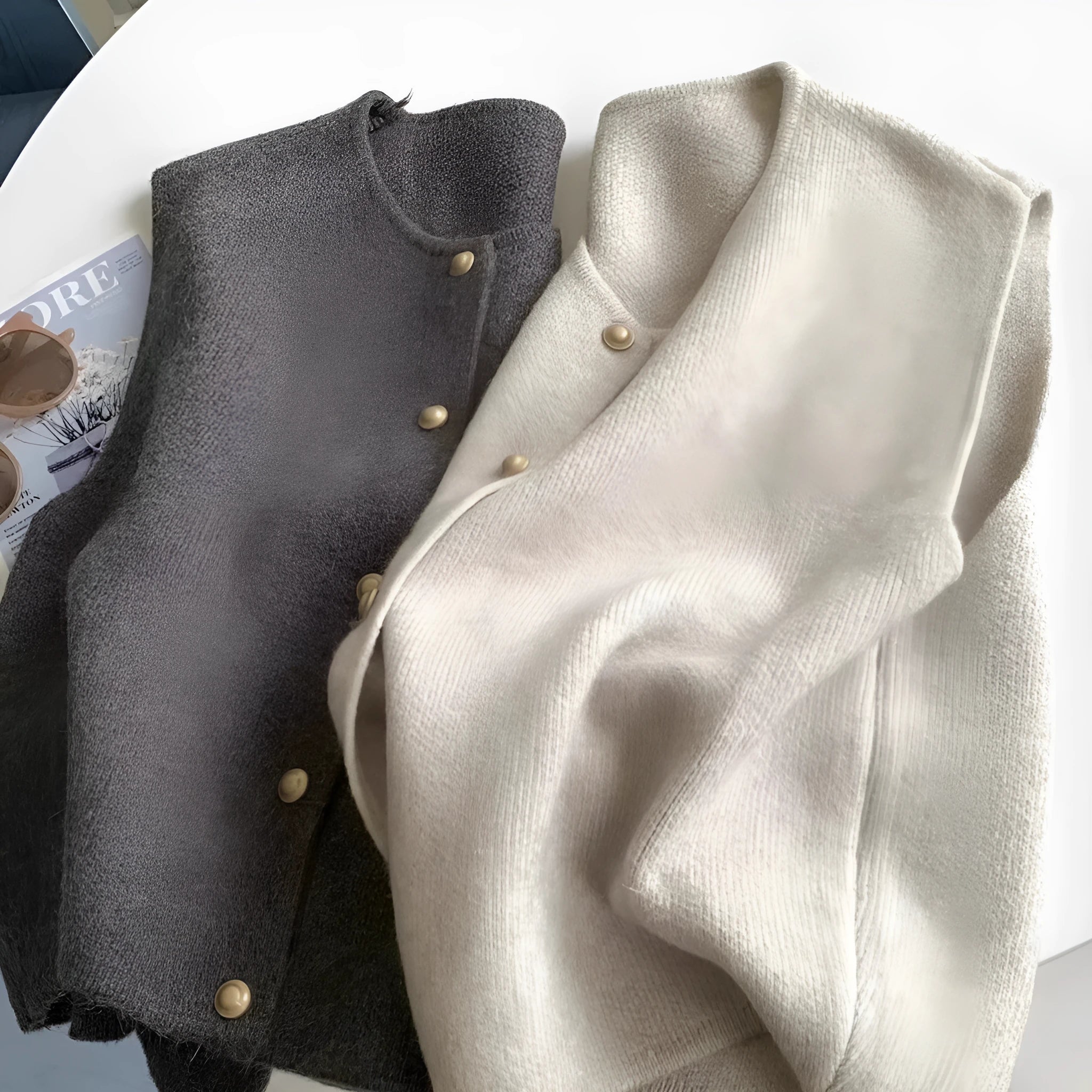 A smoky grey polyester half-sleeve pullover vest laid flat, showing its regular sleeve and commuter style.