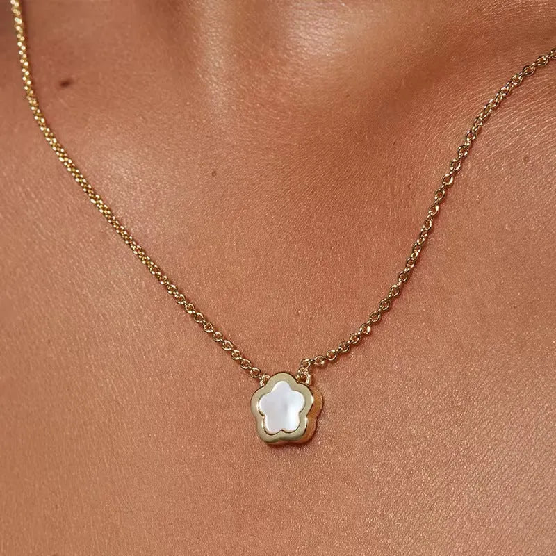 White mother-of-pearl flower necklace with floral pendant on chain