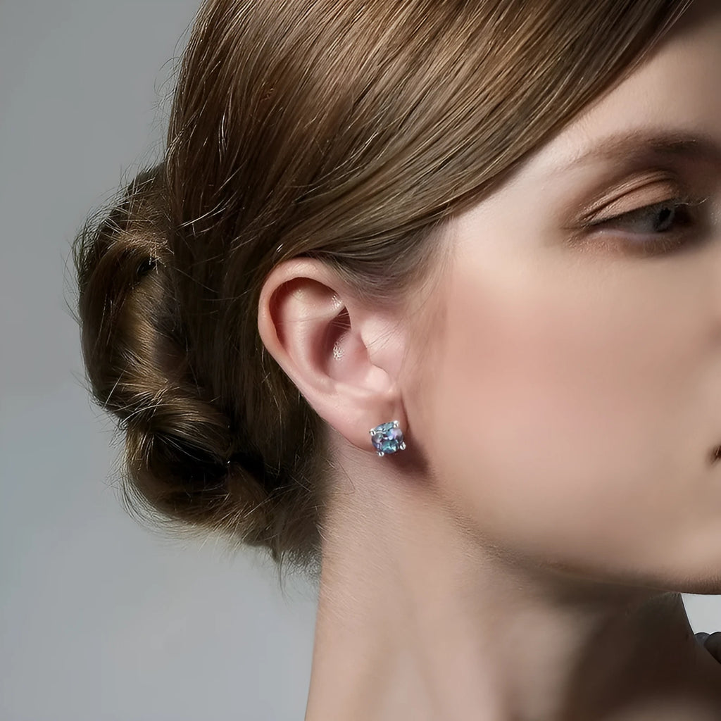 A pair of women's geometric ear studs with a round cultivated Alexander stone set in 925 silver.