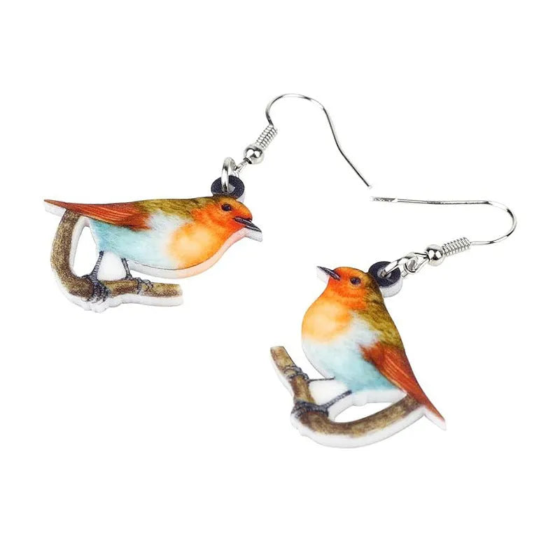Blue Titmouse and snake motif acrylic drop earrings with geometric pendant shape on a white background.