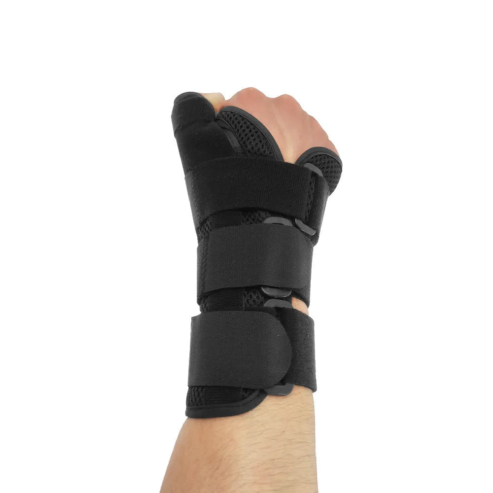 Black carbon fibre wrist guard with thumb strap and grey edging, shown for left and right hand.