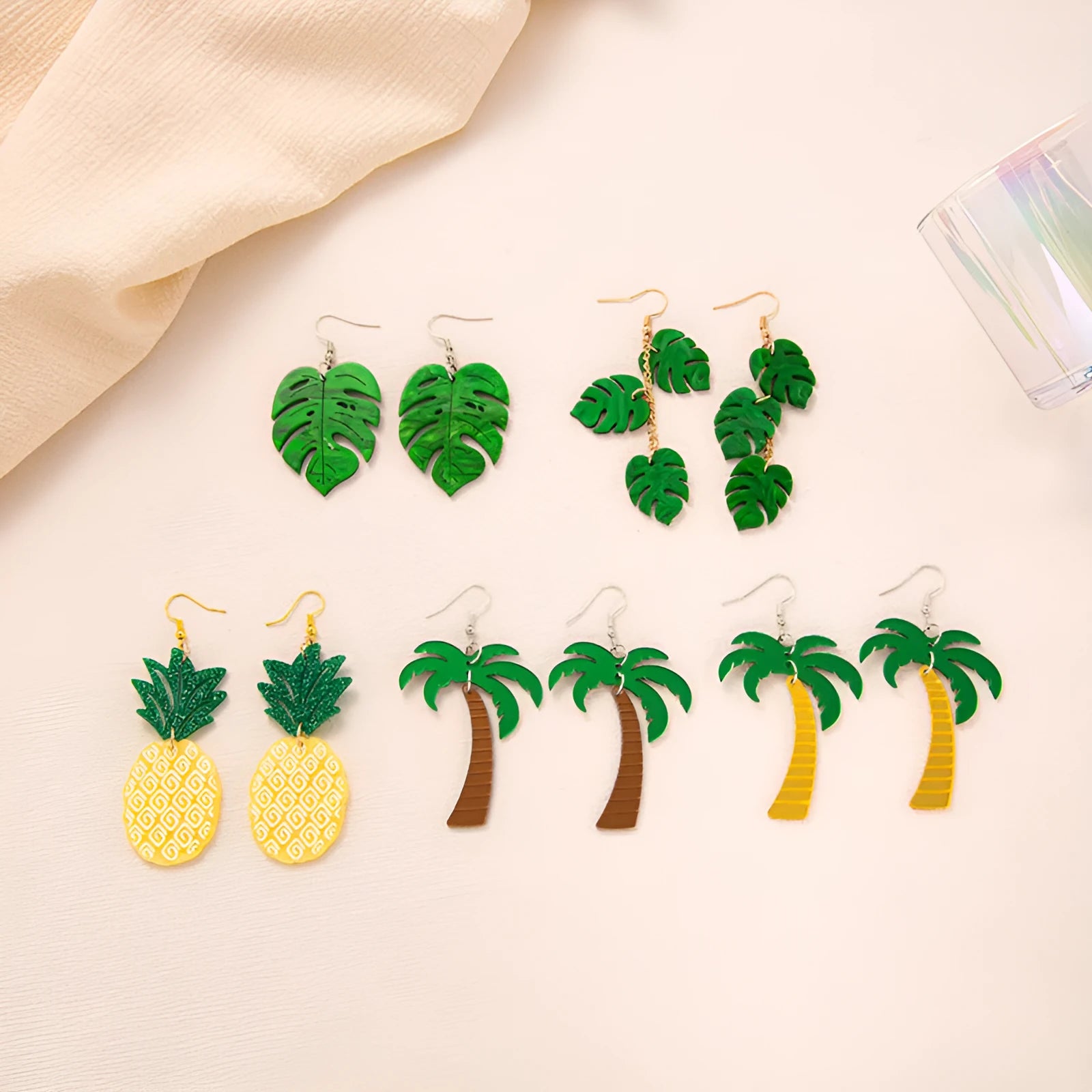 Acrylic drop earrings with coconut and jackfruit design on the ear hook in one of five styles.
