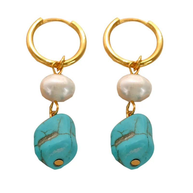 A set of two pairs of women's ear clips: one short and one dangle style, with geometric copper design, turquoise, and cultured pearls.