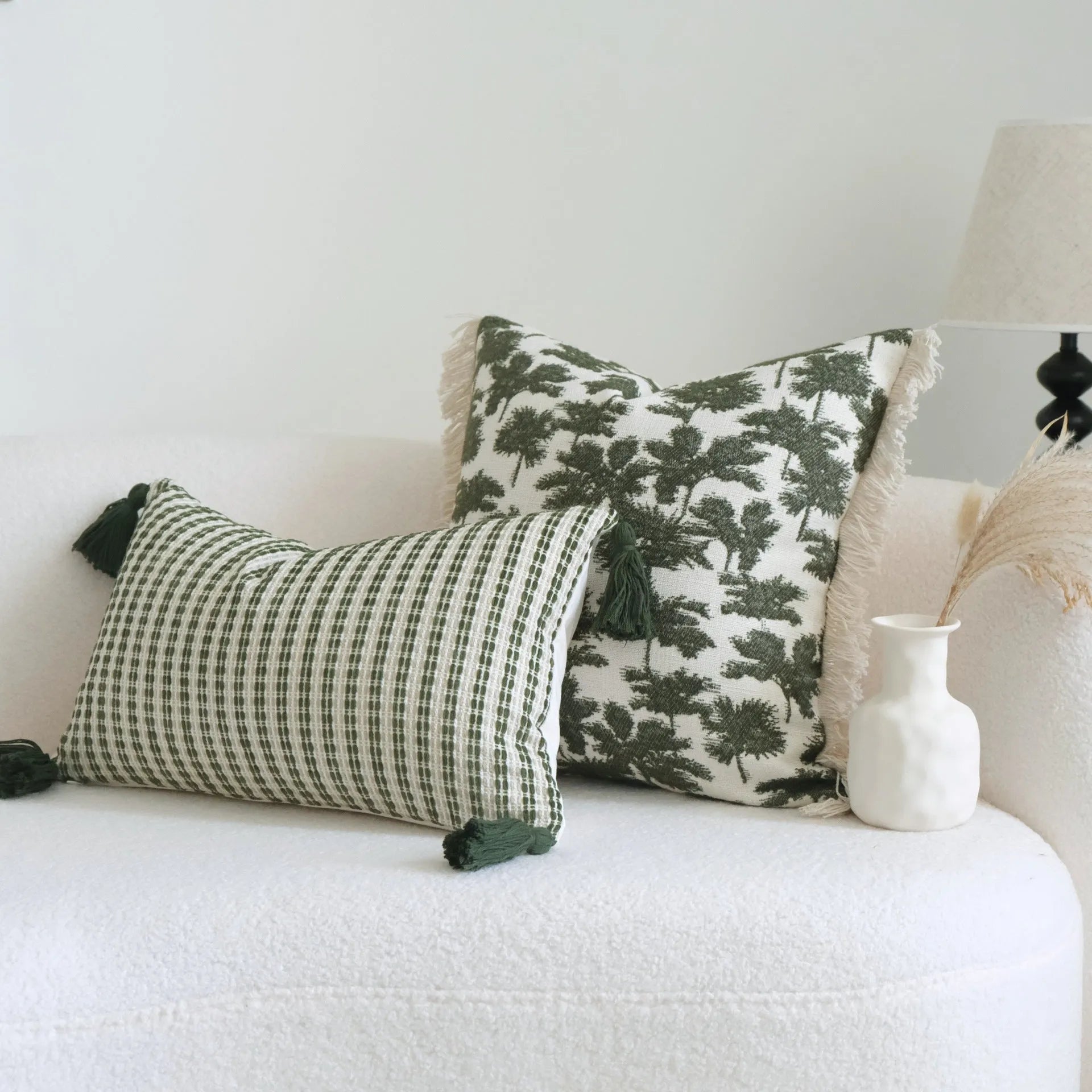 Green cotton and linen hotel sample pillow with tassel or beaded trim, shown in one of three pattern options.