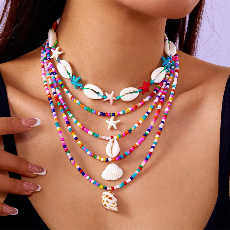 Blue multi-layer women's necklace with starfish shell beads and adjustable chain
