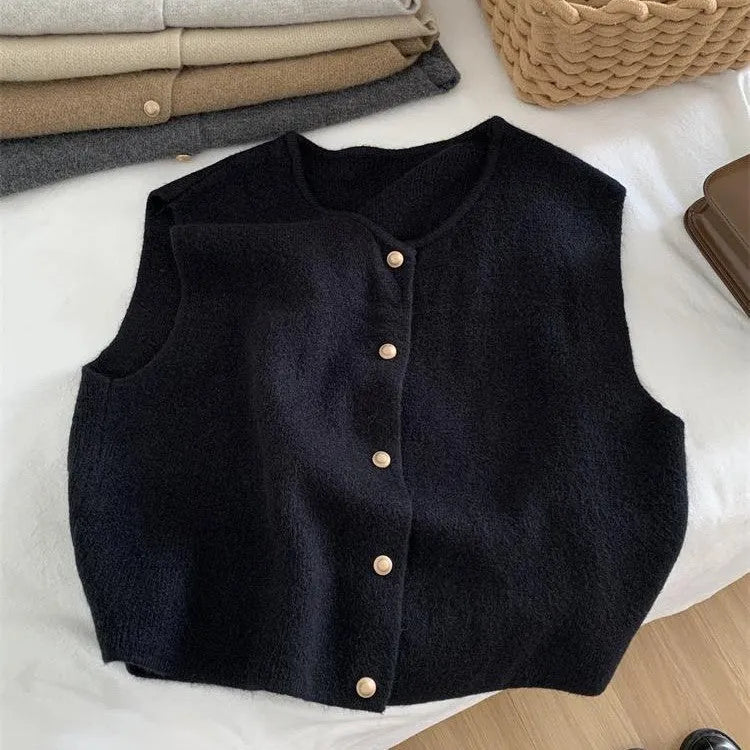 A smoky grey polyester half-sleeve pullover vest laid flat, showing its regular sleeve and commuter style.