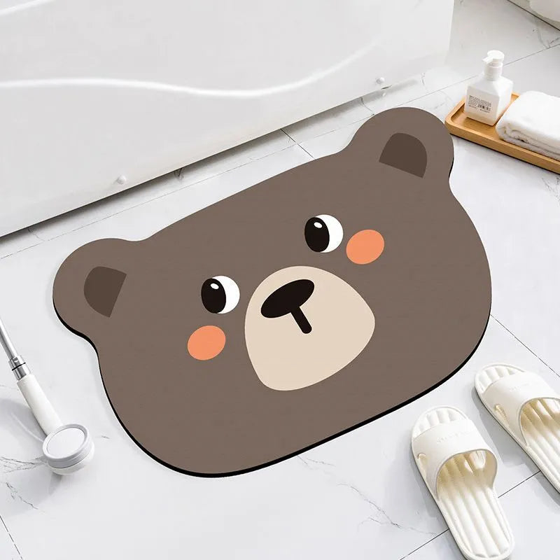 Cartoon animal diatomite absorbent bathroom mat in alien shape on bathroom floor.