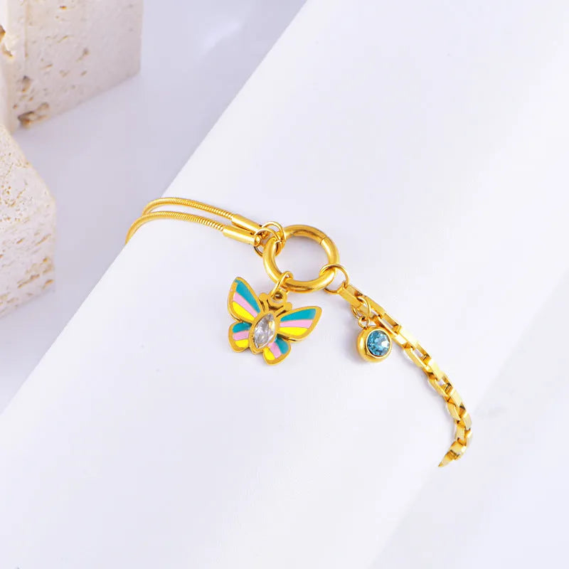 Gold titanium steel butterfly necklace and bracelet jewellery set with animal modelling details
