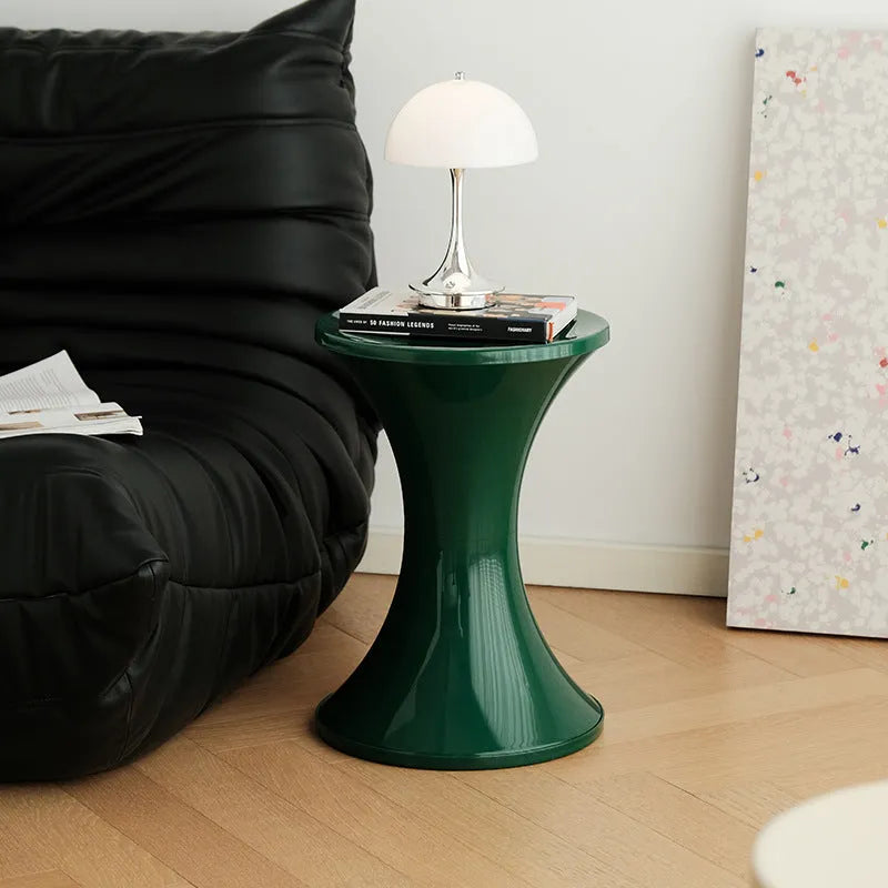 A plastic hourglass-style shoe changing stool in one of five available colours.